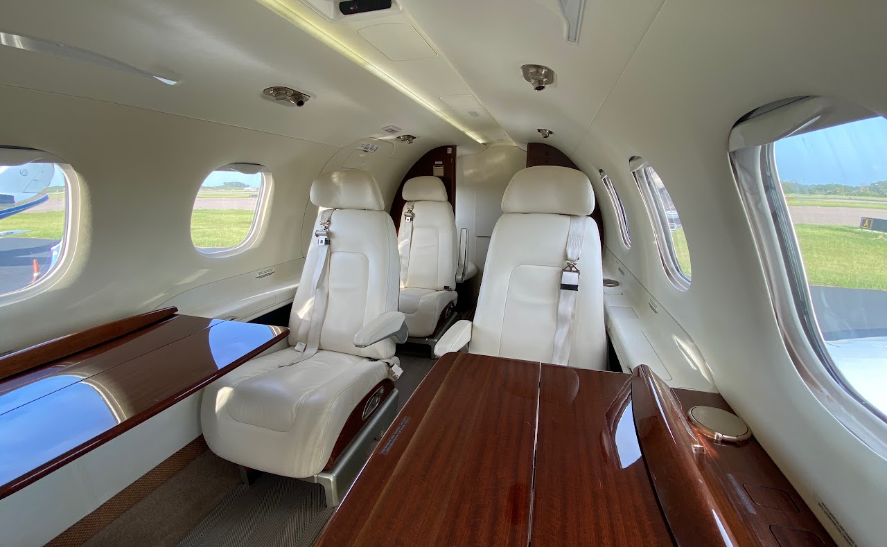 Cabin seats with tables deployed and power outlets