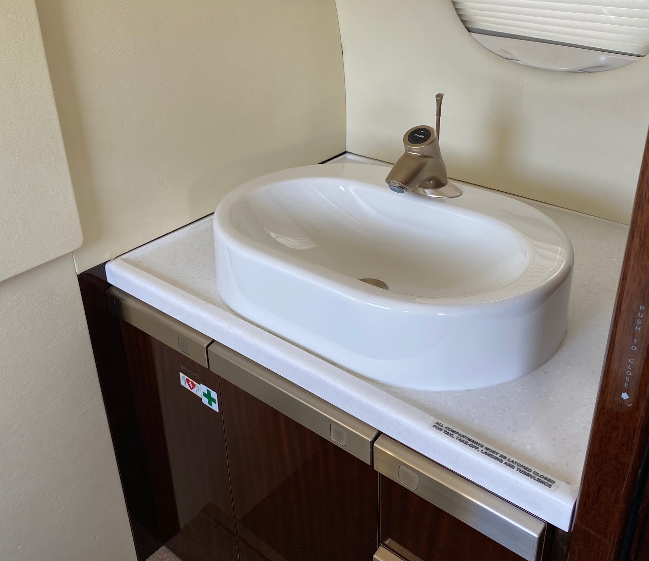 Private lavatory with a porcelain sink and vanity
